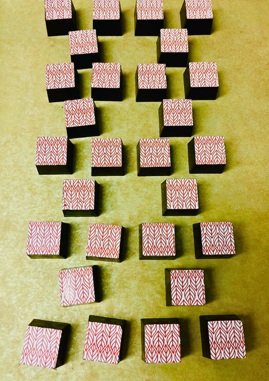 geometric square chocolate truffles with orange and yellow leaf pattern