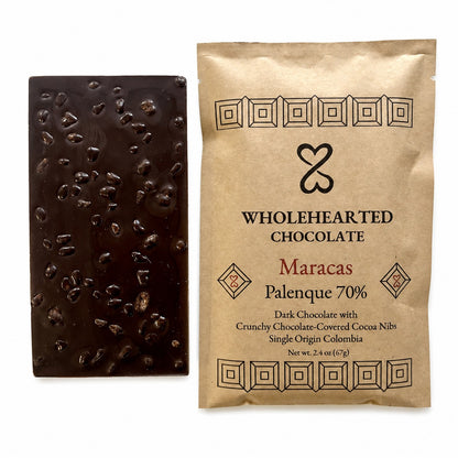 Maracas Palenque 70% dark chocolate bar with cacao nibs beside its package