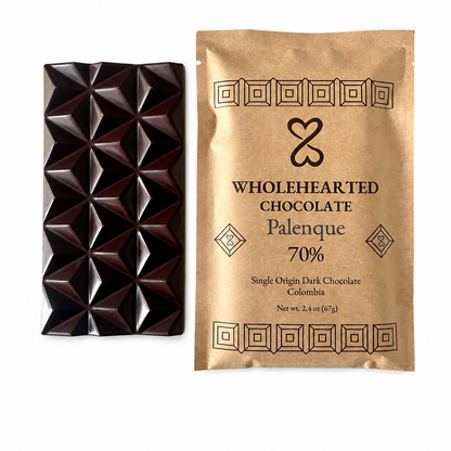 Pure Palenque 70% molded dark chocolate bar beside its kraft paper package