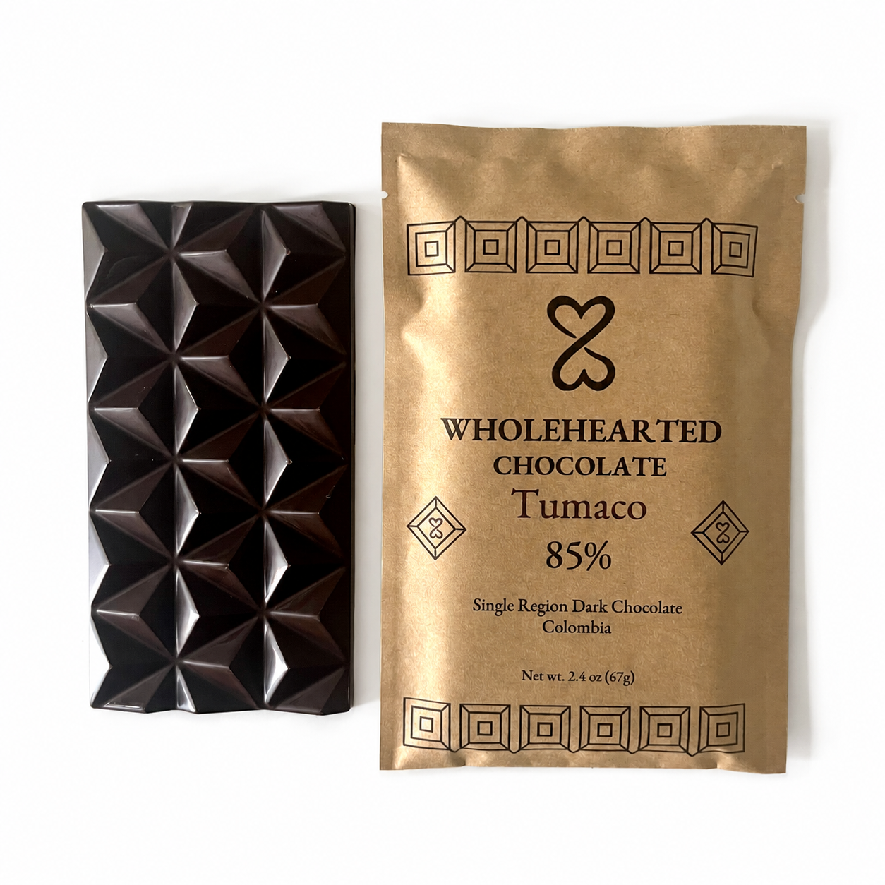 Tumaco 85% molded dark chocolate bar beside its kraft paper package