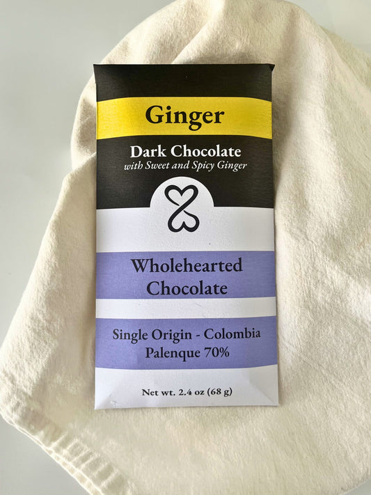 dark chocolate bar packaging. Ginger. placed on linen background
