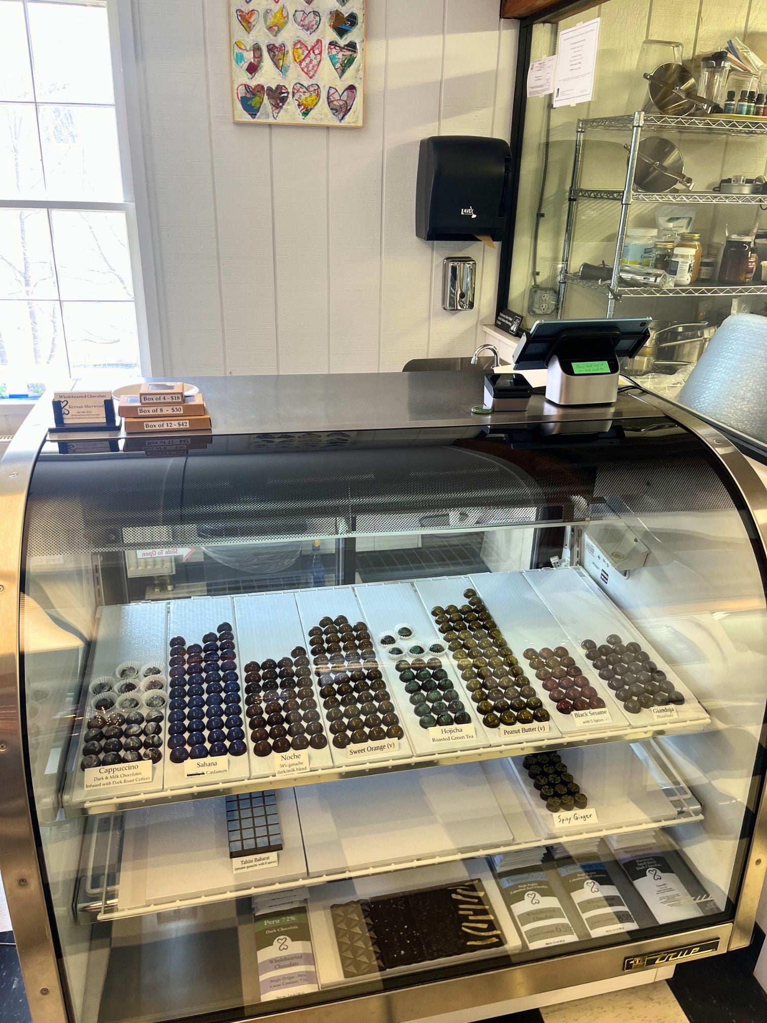 Display case with chocolate truffles in a store setting