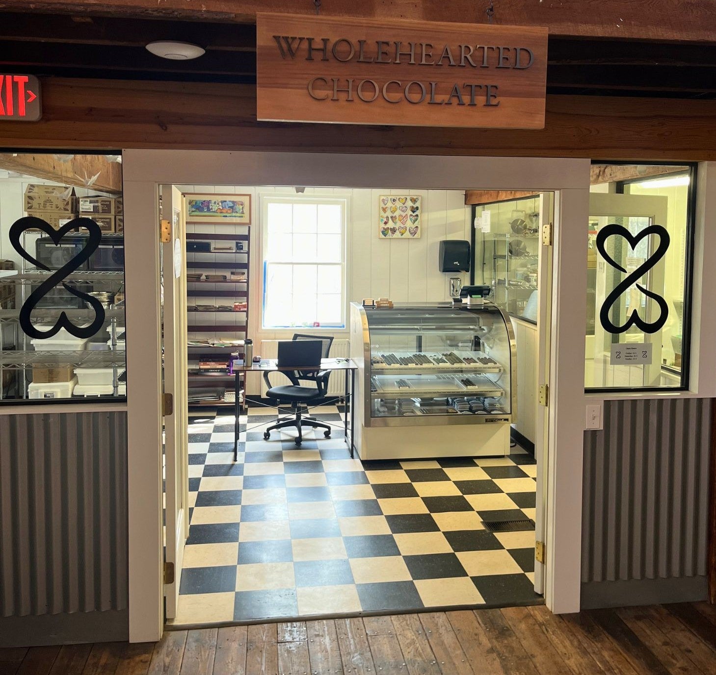 Storefront with Wholehearted Chocolate sign above double door entryway