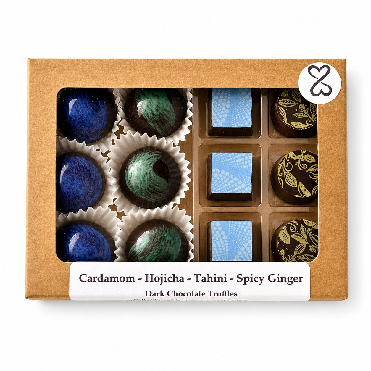 Box of dark chocolate bonbons with a label on a white background