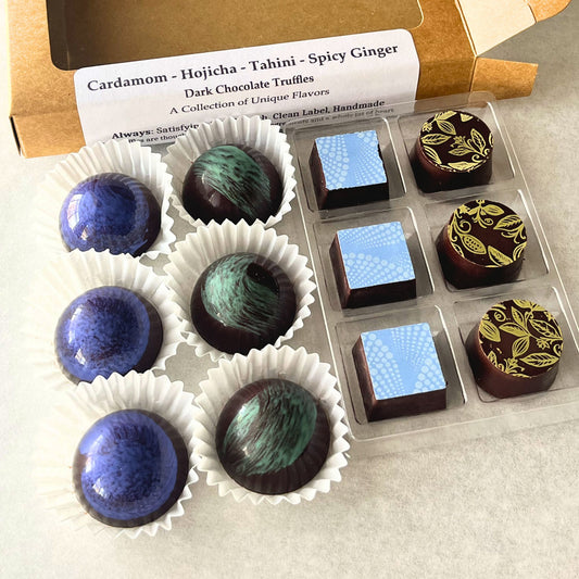 twelve Assorted dark chocolate truffles outside of a kraft paper box