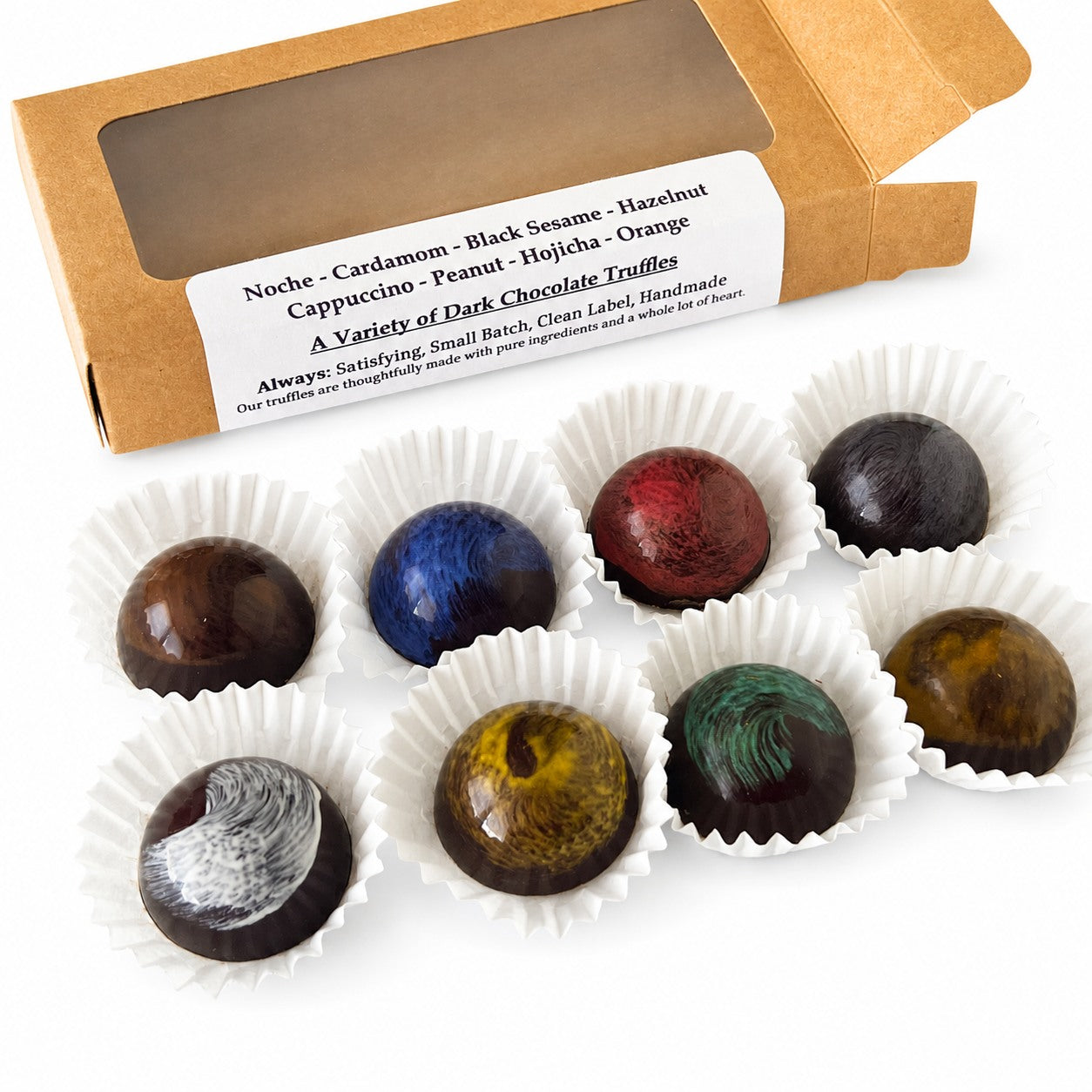 Assorted dark chocolate truffles in white paper cups with a cardboard box labeled 'A Variety of Dark Chocolate Truffles'.