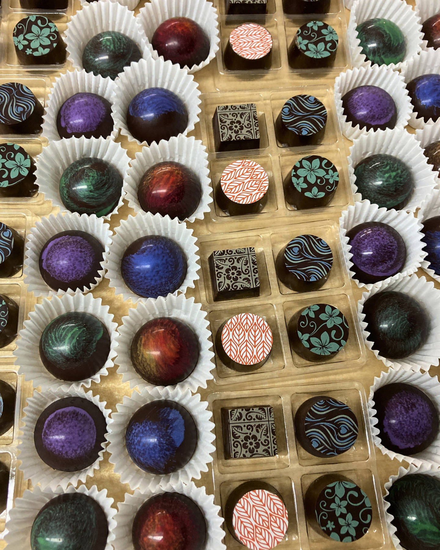 a variety of colorful dark chocolate truffles