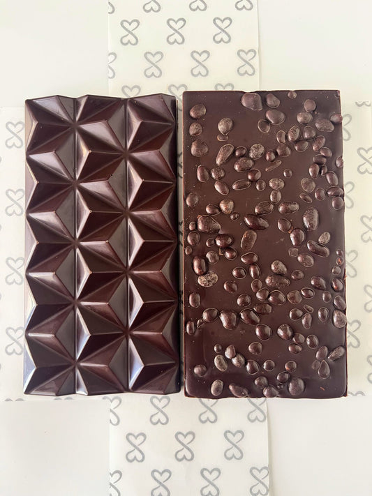 front and back image of a 70% dark chocolate bar topped with chocolate covered cocoa nibs
