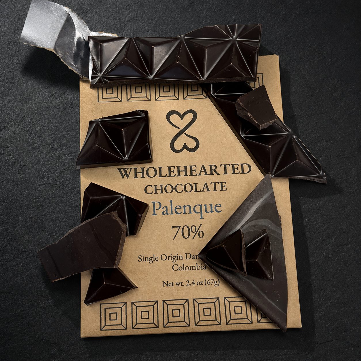 Broken Pure Palenque 70% dark chocolate pieces scattered over the package