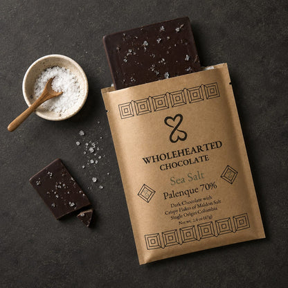 Sea Salt Palenque 70% chocolate, package and a small bowl of sea salt on a dark surface